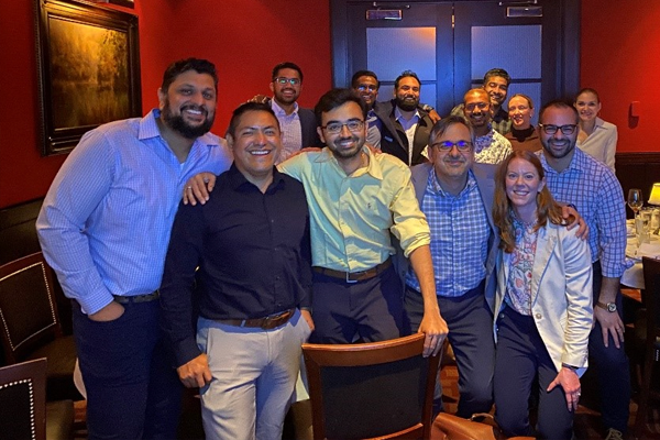 Fellows posing in a restaurant