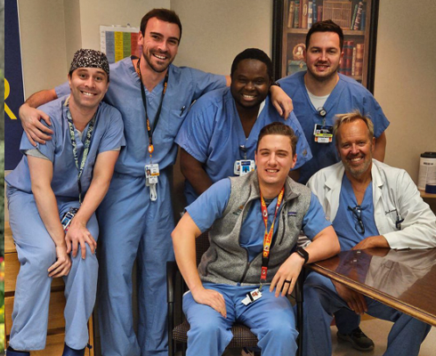 Male residents posing in an indoor setting