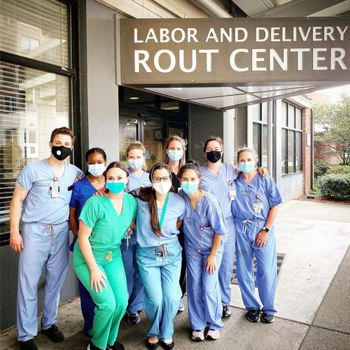 Residents with masks outside labor and delivery 