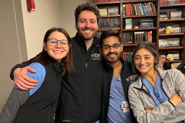 Residents posing in an office setting