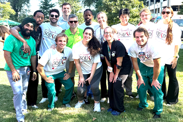 Residents posing outside in the sun