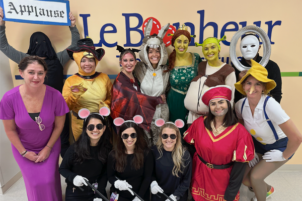 Female faculty and fellows dressed up in Halloween costumes
