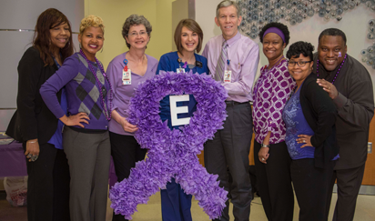 Group of peds faculty with a purple ribbon