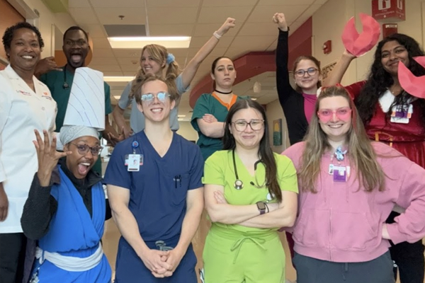Residents clowning around in the hospital hallway
