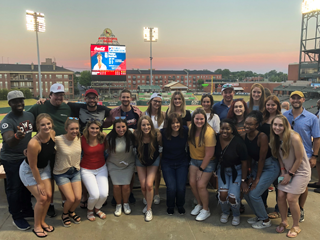 Residents at a baseball game