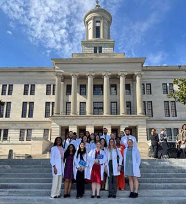 Group photo in front of a legislative building
