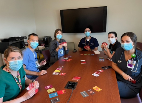 Team Playing “Organ Attack” Card Game for Morning Report