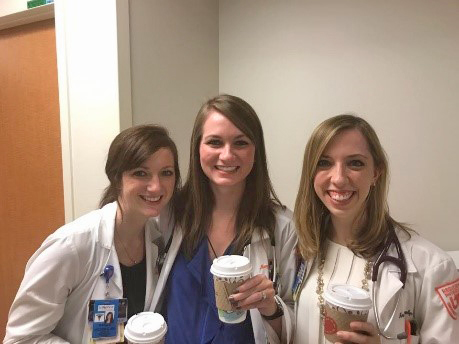 Three female residents with coffee