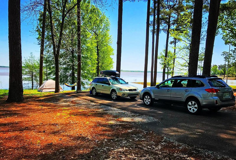 Cars and tent at the lake