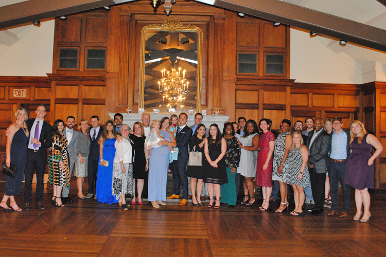 Fellows, faculty, and families at graduation