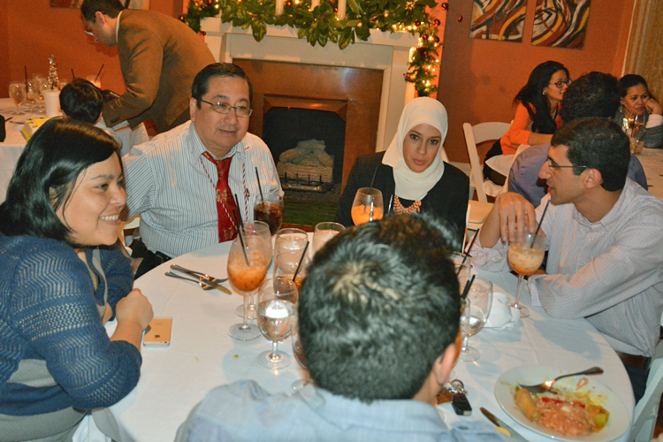 Fellows and faculty gathered at a dinner table