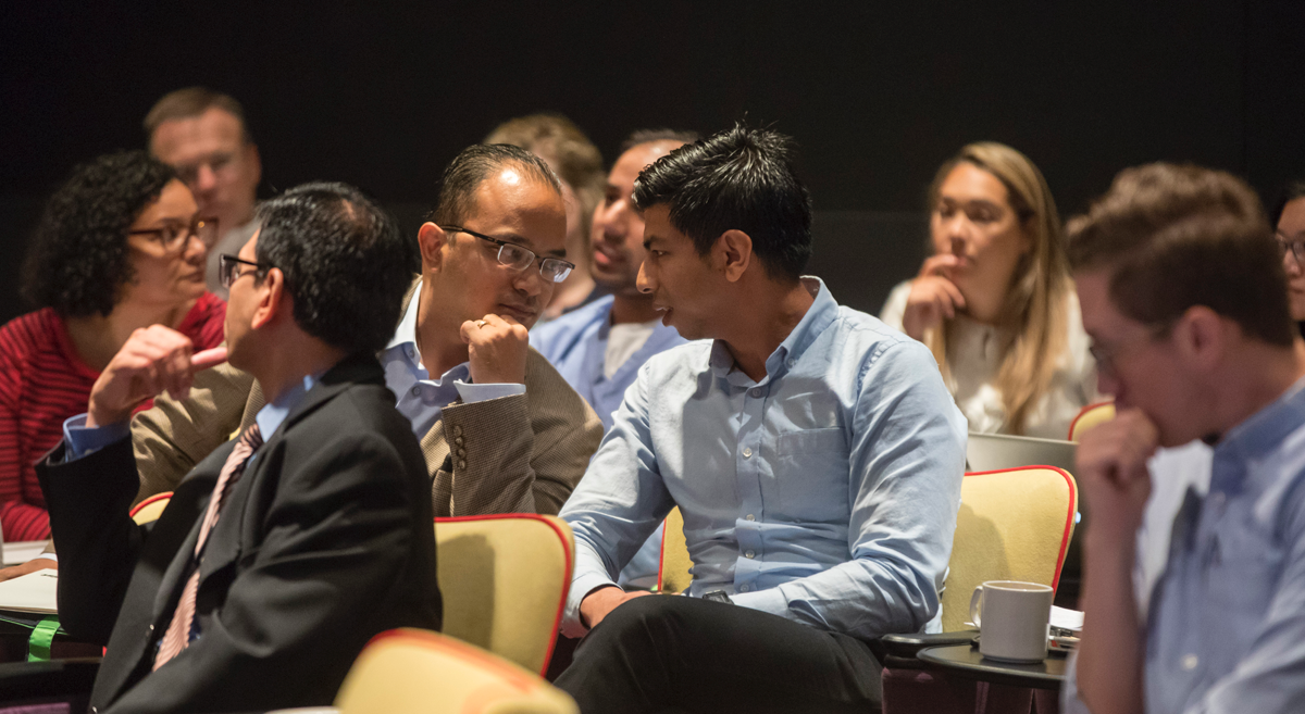 Attendees of the conference in discussion