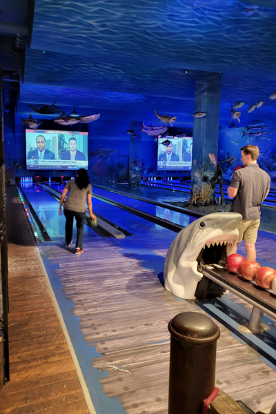 Residents bowling in the Bass Pro Shop