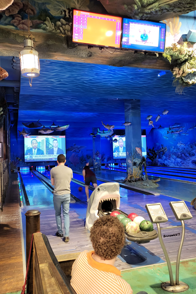 Residents bowling in the Bass Pro Shop